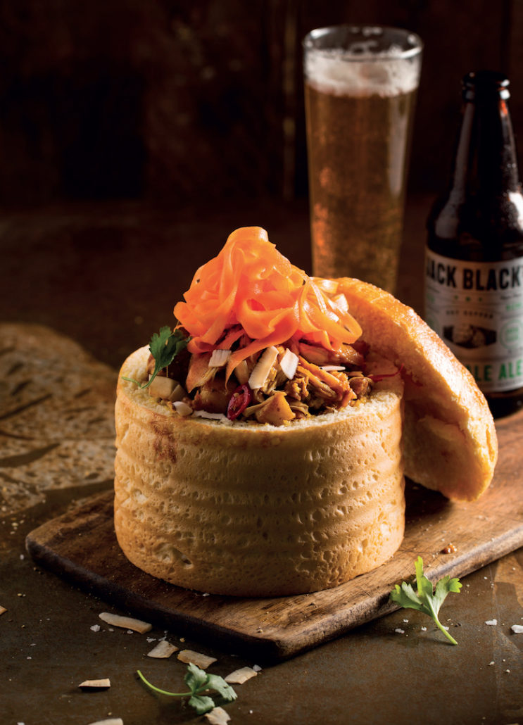 Chicken curry bunny chow with carrot-pickle