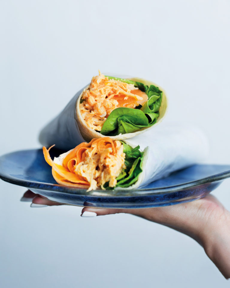 Wholewheat curry chicken wraps with baby spinach and carrots