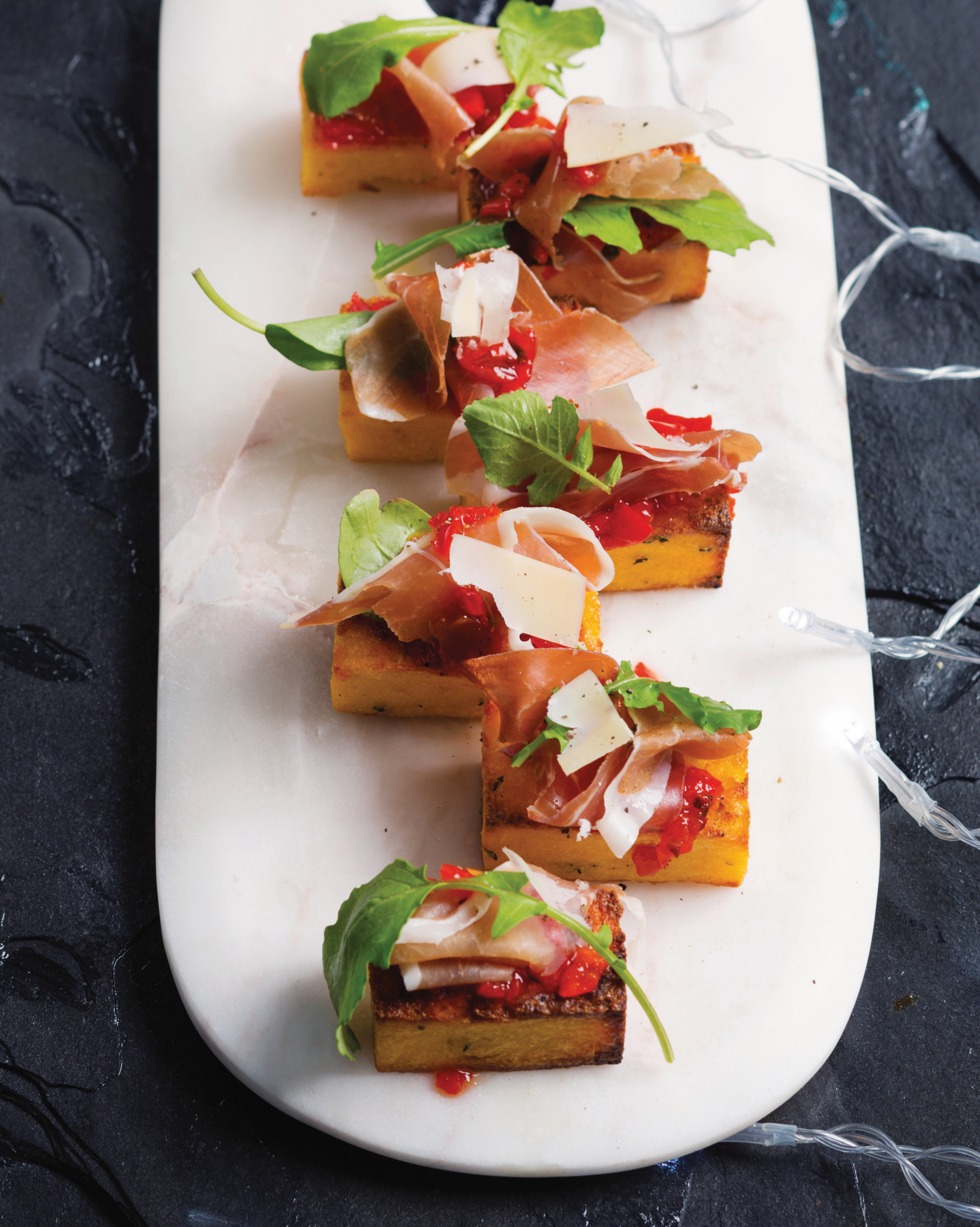You are currently viewing Polenta chips with prosciutto, Peppadew and Parmesan