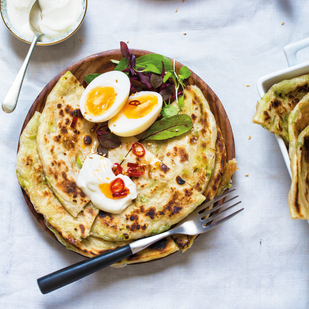 You are currently viewing Flaky spring onion pancakes with jammy eggs & chilli oil 