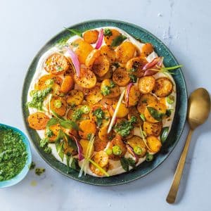 Read more about the article Roast potatoes on cumin-garlic yoghurt with coriander chutney 