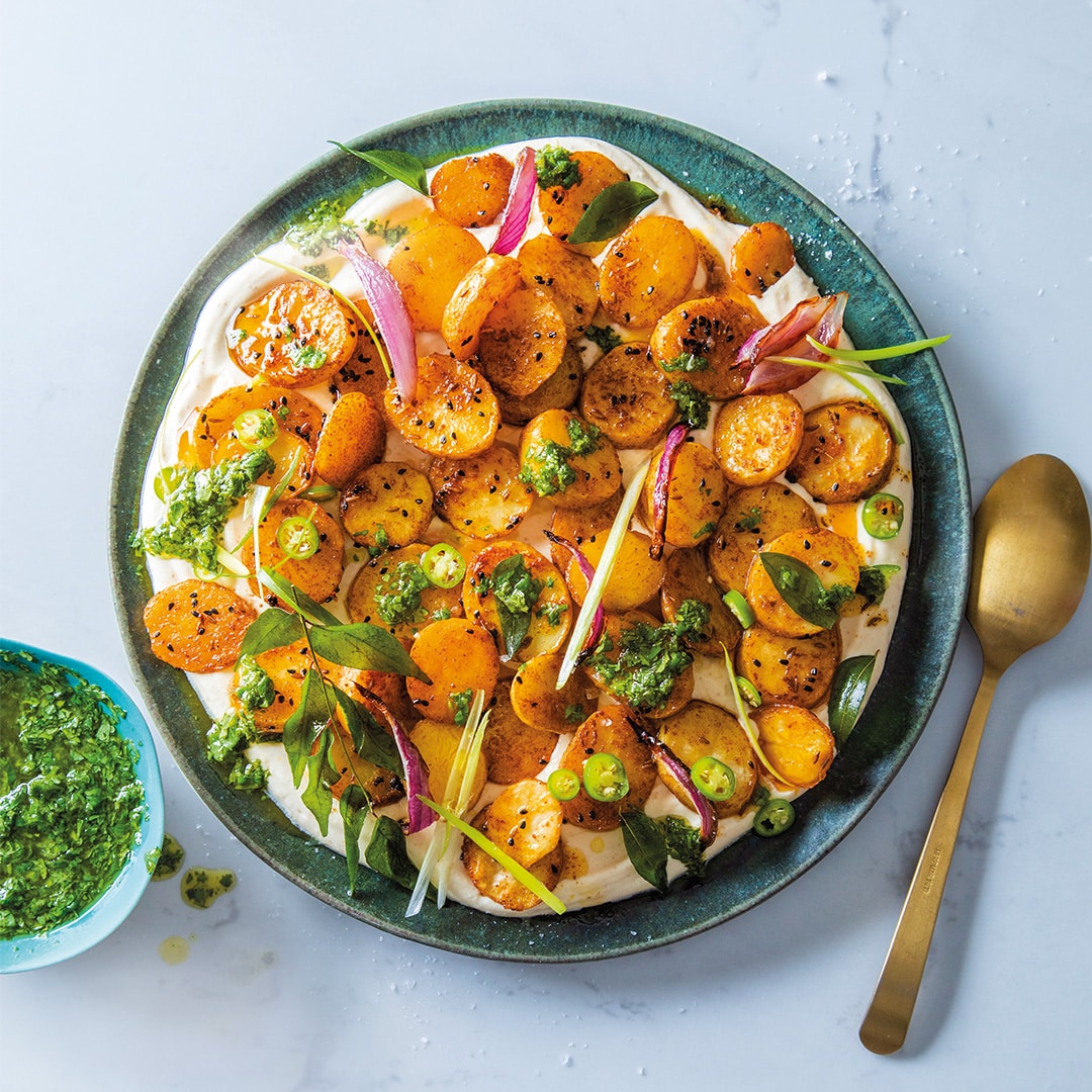 You are currently viewing Roast potatoes on cumin-garlic yoghurt with coriander chutney 