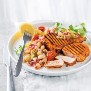 Read more about the article Paprika grilled pork chops with tomato-braised beans 