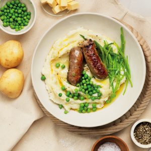 Bangers and mash with buttery peas